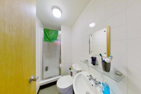 A clean and functional bathroom featuring a sin...