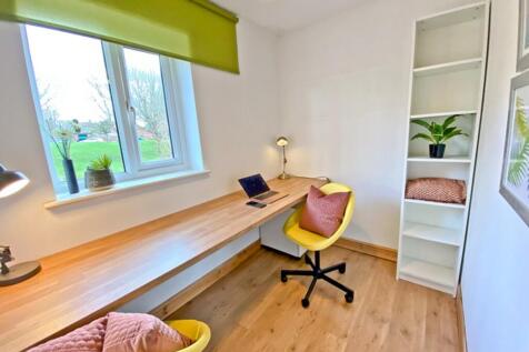 This bright and inviting communal workspace fea...