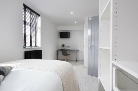 A bright and spacious double bedroom featuring ...