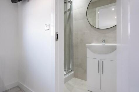 A modern and well-maintained bathroom with a sl...