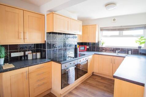 This modern kitchen features ample countertop s...
