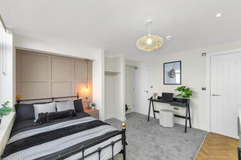 A stylish double bedroom featuring a comfortabl...