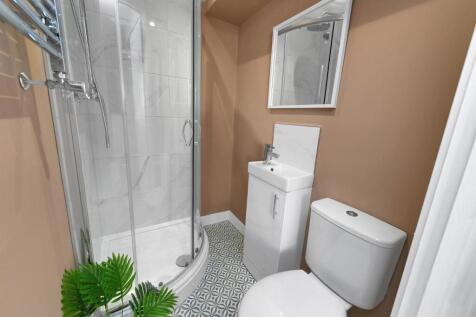 This modern bathroom features a sleek design wi...