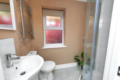 A well-maintained bathroom featuring a modern s...