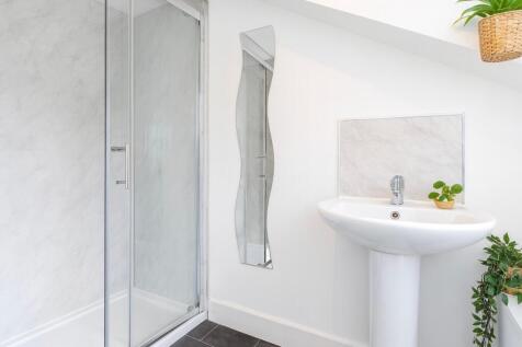 A bright and clean bathroom featuring a modern ...