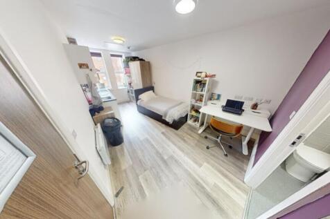A bright and spacious double bedroom featuring ...