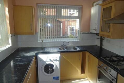 A bright and functional kitchenette with modern...