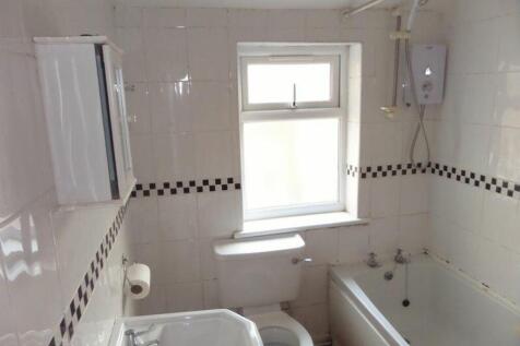 A clean and functional bathroom featuring a bat...