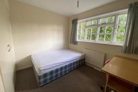 A bright and inviting double bedroom with ample...