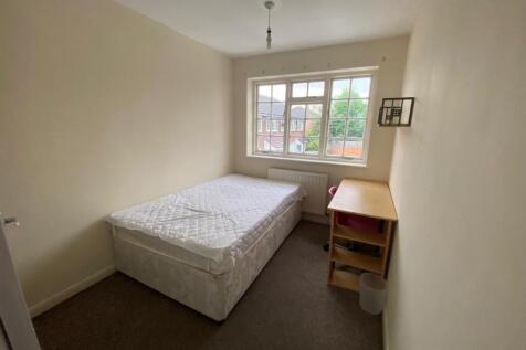 A bright and spacious double bedroom with large...
