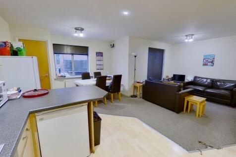 Bright and inviting living room featuring a coz...