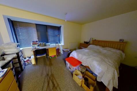 Cozy double bedroom featuring a comfortable dou...