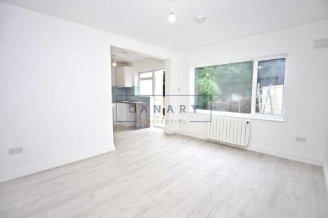 A bright and airy living room with large window...