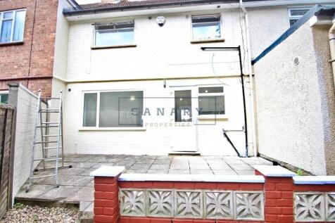 Bright and well-maintained rear exterior of a t...