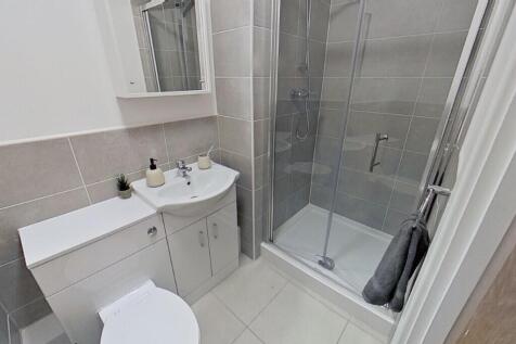 A modern bathroom featuring a sleek design, wit...