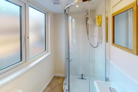 A bright and modern bathroom featuring a sleek ...