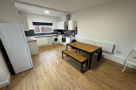 Modern kitchen with ample space for cooking and...