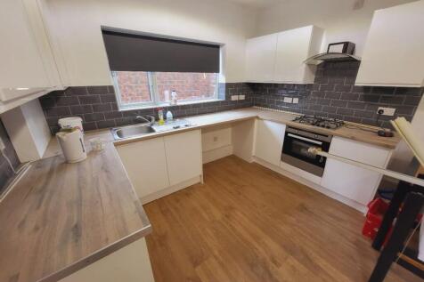 Bright and spacious kitchen featuring modern ca...