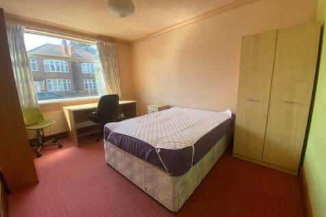 A bright and spacious double bedroom with ample...