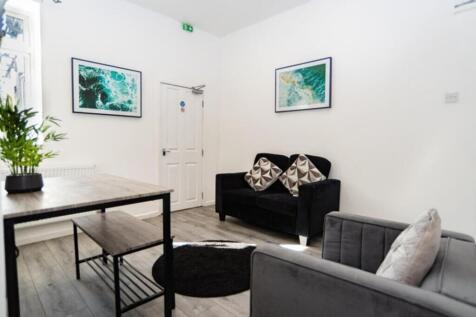 A bright and inviting living room featuring mod...