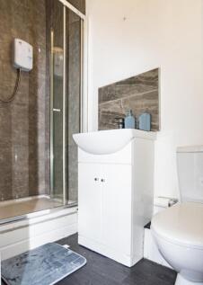 A modern bathroom featuring a sleek design with...