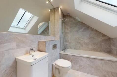 A stylish bathroom suite featuring a modern bat...