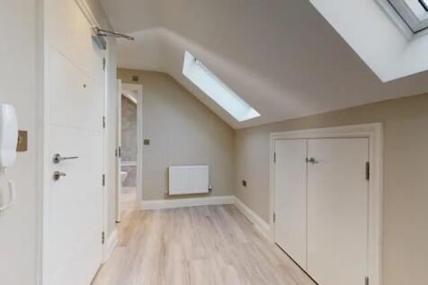 Bright and clean hallway with modern light wood...