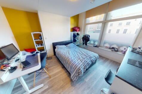 A bright and spacious double bedroom featuring ...