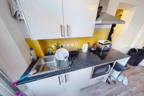 This modern kitchen features a sleek design wit...