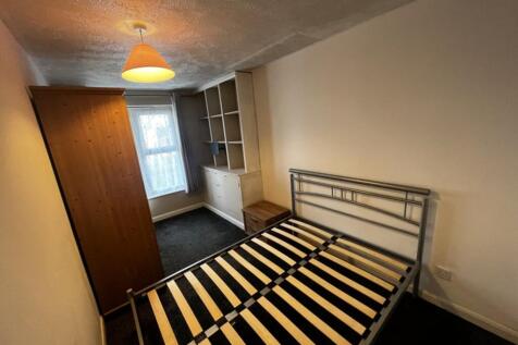 Inviting double bedroom featuring ample natural...