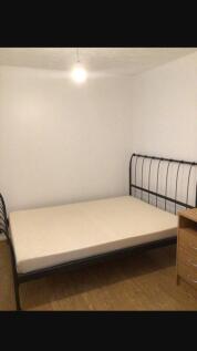 Spacious double bedroom featuring a modern meta...