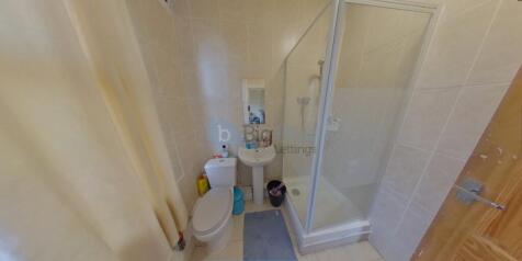 A clean and modern bathroom featuring a spaciou...
