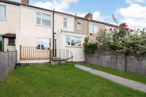 A well-maintained terraced house exterior with ...