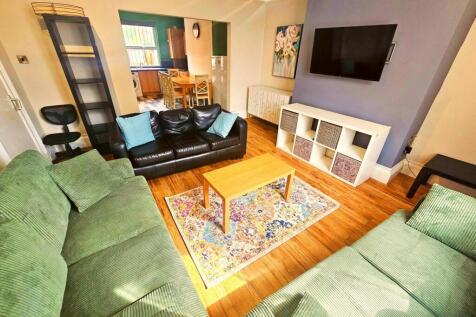 Bright and inviting living room featuring conte...