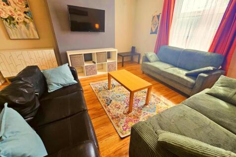 Bright and inviting living room featuring comfo...