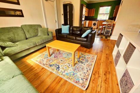 A cozy and inviting living room featuring comfo...