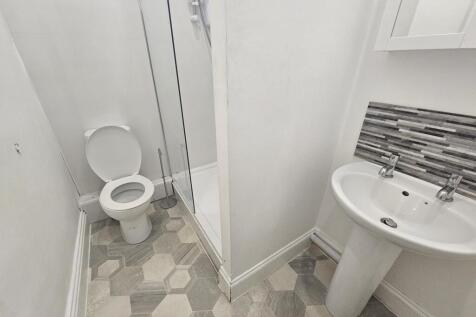 Modern and clean bathroom with a spacious showe...