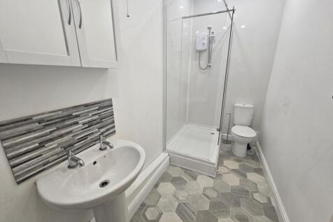 A clean and well-maintained bathroom featuring ...
