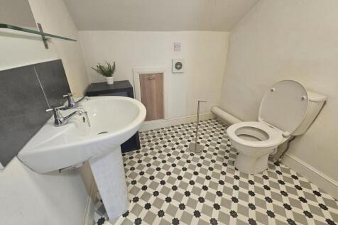 A clean and well-maintained bathroom featuring ...