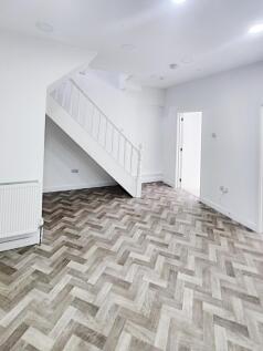 Bright, newly refurbished living area with mode...