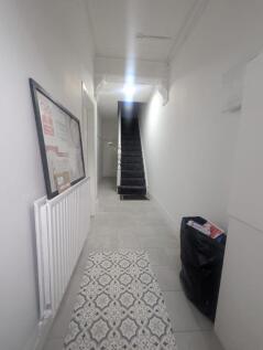 Spacious and well-maintained hallway with a sty...