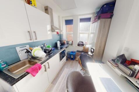 A modern kitchen featuring ample counter space,...