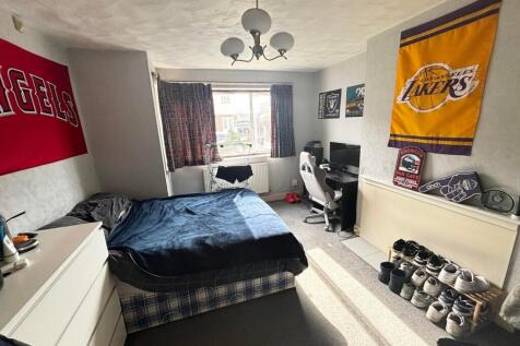 Spacious double bedroom featuring good natural ...