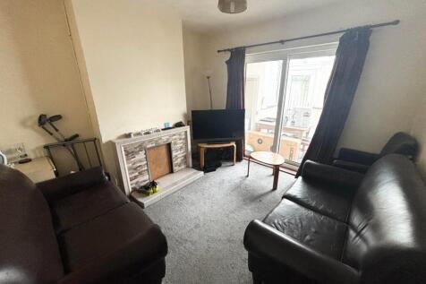 A cozy living room featuring comfortable leathe...