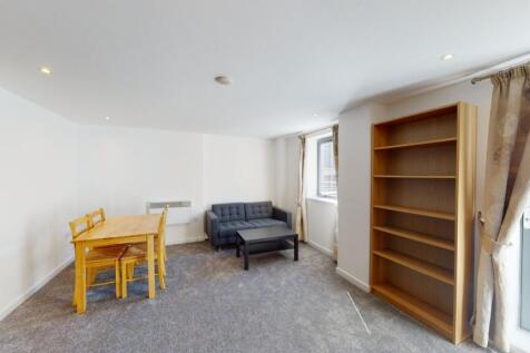 Bright living room featuring a cozy seating are...