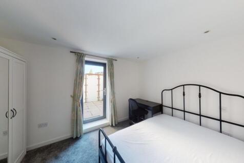 Bright and tidy double bedroom featuring a stur...