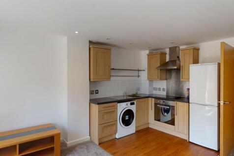 Bright and clean kitchen featuring modern appli...