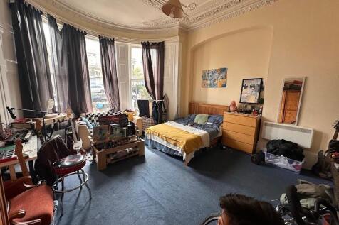 Spacious and charming master bedroom featuring ...