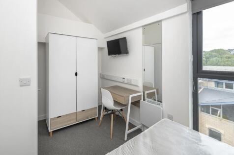 A bright and modern double bedroom featuring a ...