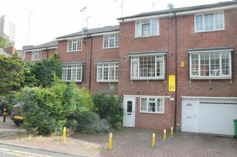 Charming front view of a well-maintained red br...